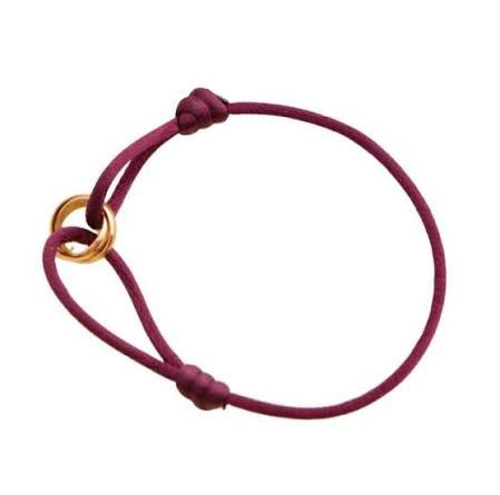 Wine coloured cord bracelet with gold ring charm